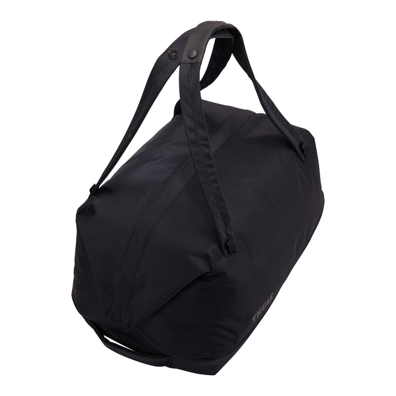 Load image into Gallery viewer, Thule Subterra 2 Duffel 35L in black, with sturdy handles and zipper closure, designed for durable travel and storage.