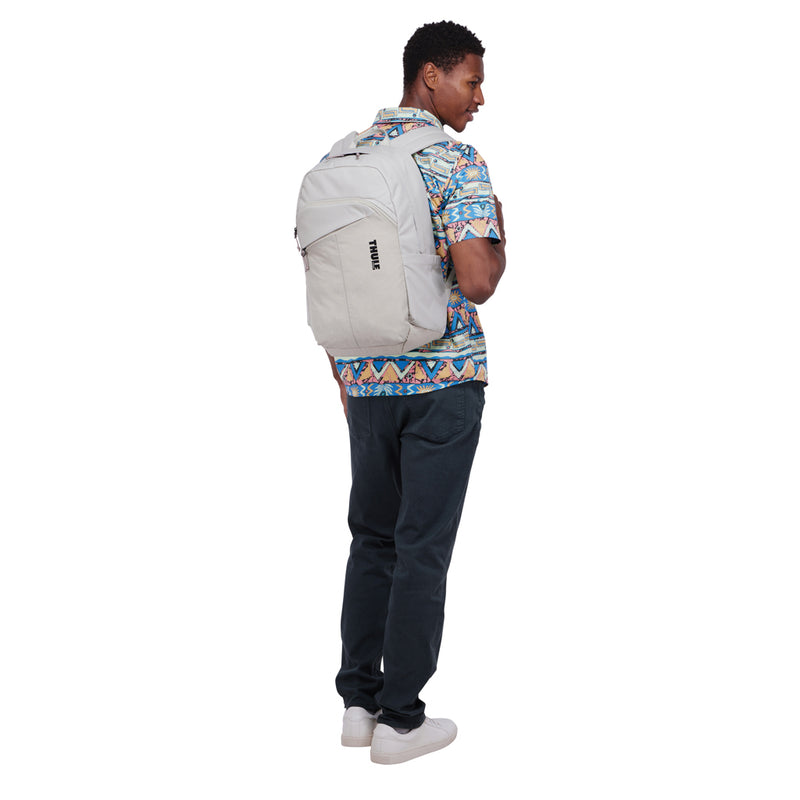 Load image into Gallery viewer, Thule Indago 23L backpack in black with multiple compartments for travel and daily use, featuring padded shoulder straps.