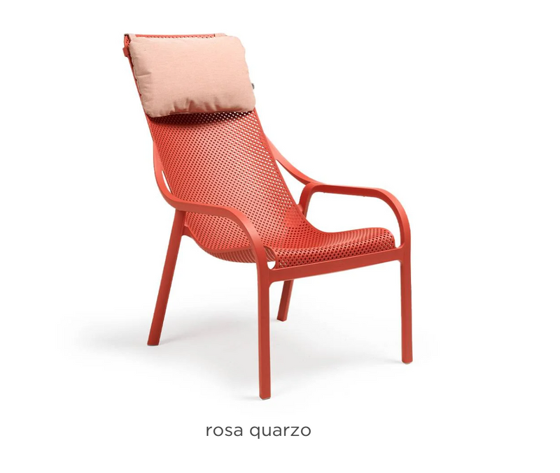 Load image into Gallery viewer, Pink Sunbrella Nardi Net Chair Cushion on a lounge chair, showcasing comfortable outdoor seating accessory.