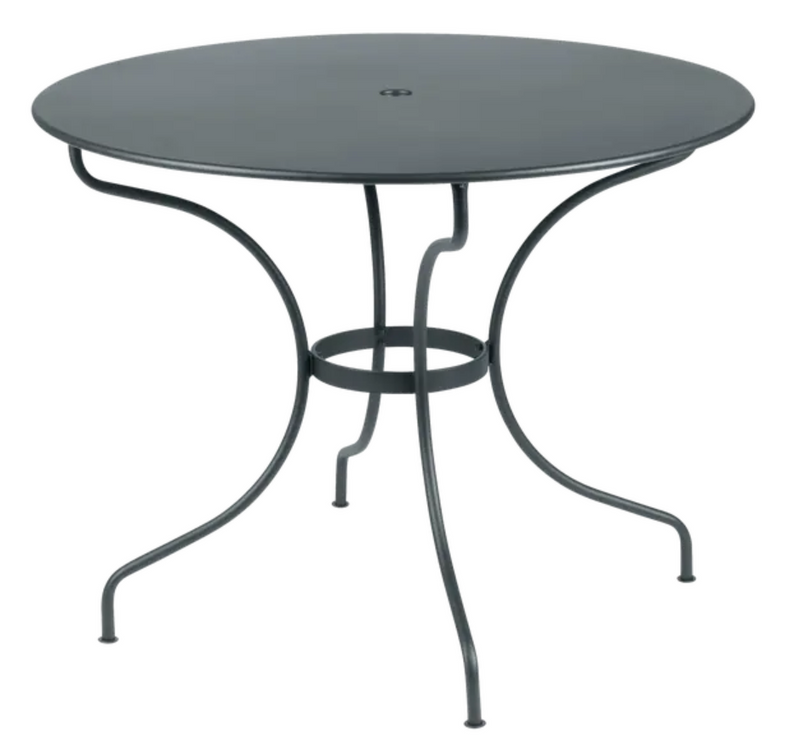 Load image into Gallery viewer, Fermob OPÉRA+ outdoor metal table in Storm Grey, 96 cm diameter, suitable for five-seater patio or garden space.
