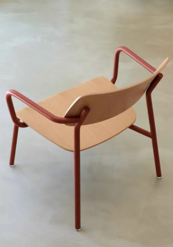 Load image into Gallery viewer, Fermob Studie Oak outdoor armchair with wooden armrests and metal frame, shown in a modern outdoor setting.