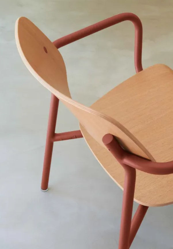 Load image into Gallery viewer, Fermob Studie Oak outdoor armchair with a modern design, featuring a wooden armrest and sleek metal frame for outdoor seating.