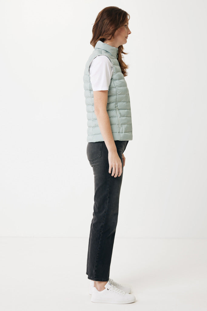 Load image into Gallery viewer, Mer women recycled polyester bodywarmer by iqoniq, close-up of the lightweight textile with a front zipper and subtle branding.