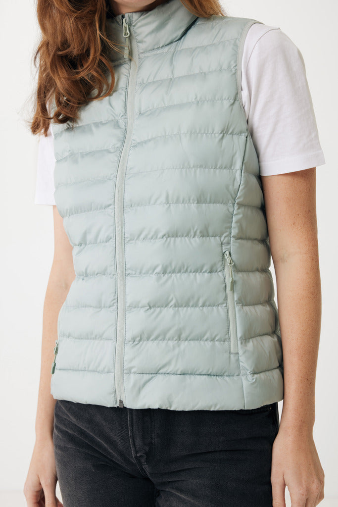 Load image into Gallery viewer, Mer women recycled polyester bodywarmer by iqoniq, showcasing a lightweight, eco-friendly textile with a sleek design and zip closure.