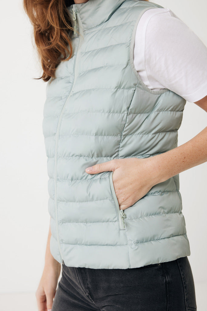 Load image into Gallery viewer, Mer women recycled polyester bodywarmer by iqoniq, showcasing the textile's front view with a zip closure and padded design.
