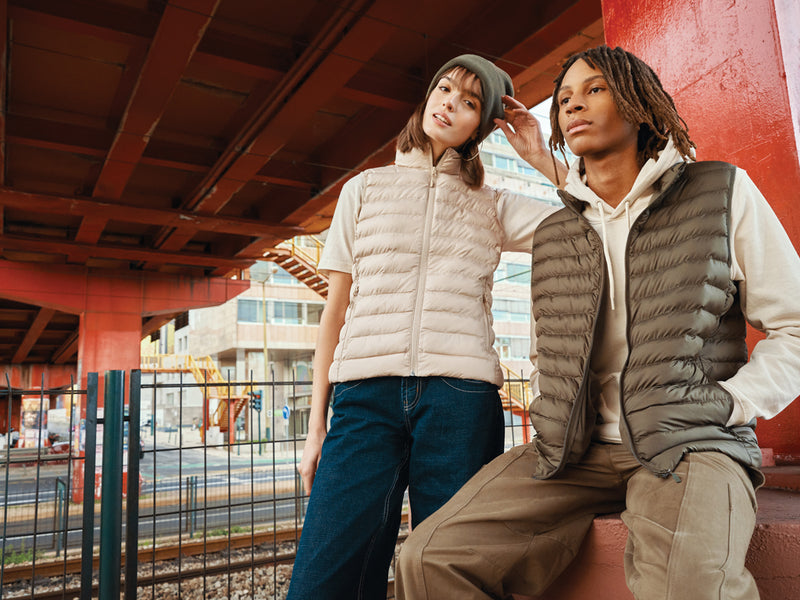 Load image into Gallery viewer, Mer women recycled polyester bodywarmer by iqoniq, showcasing a close-up of the textile's textured fabric in natural light.