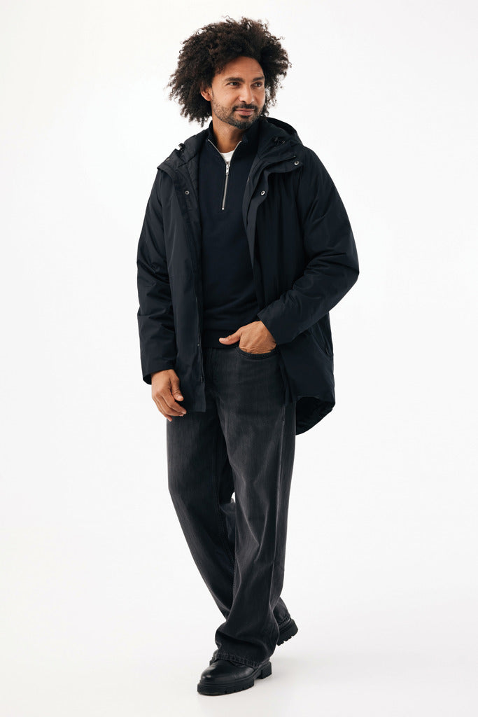 Load image into Gallery viewer, Iqoniq Thelon recycled polyester parka in textile fabric, shown in a front view with hood and zipper detail.
