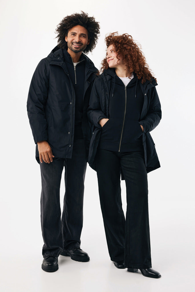 Load image into Gallery viewer, Thelon recycled polyester parka by iqoniq, showcasing a durable, eco-friendly textile with a front zipper and hood.