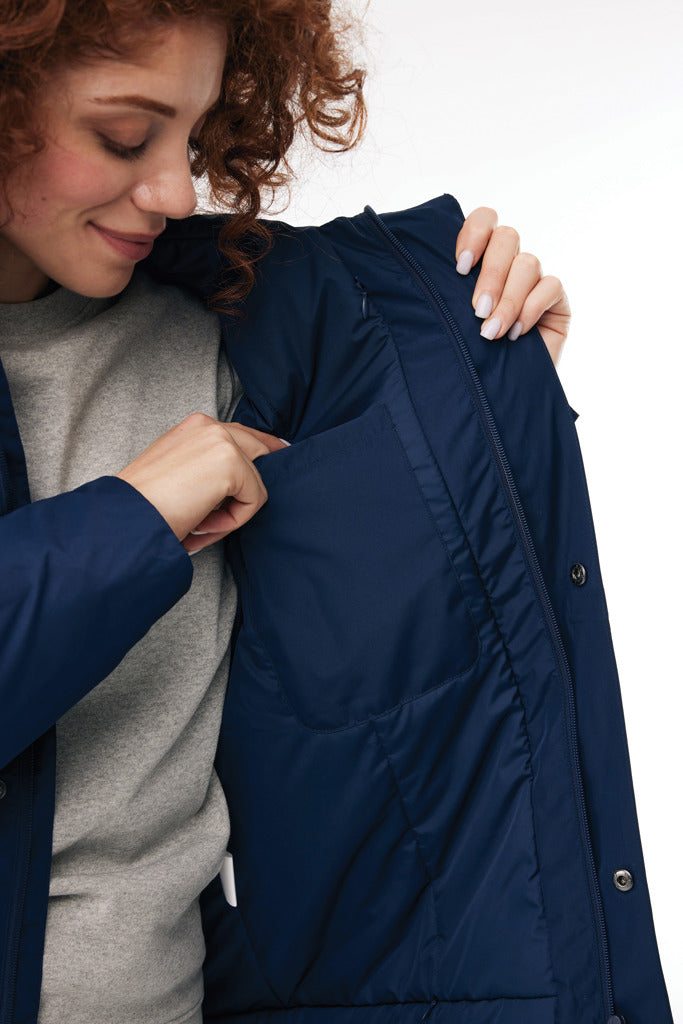 Load image into Gallery viewer, Iqoniq Thelon recycled polyester parka in textile, shown in dark color with hood and front zipper for eco-friendly winter wear.