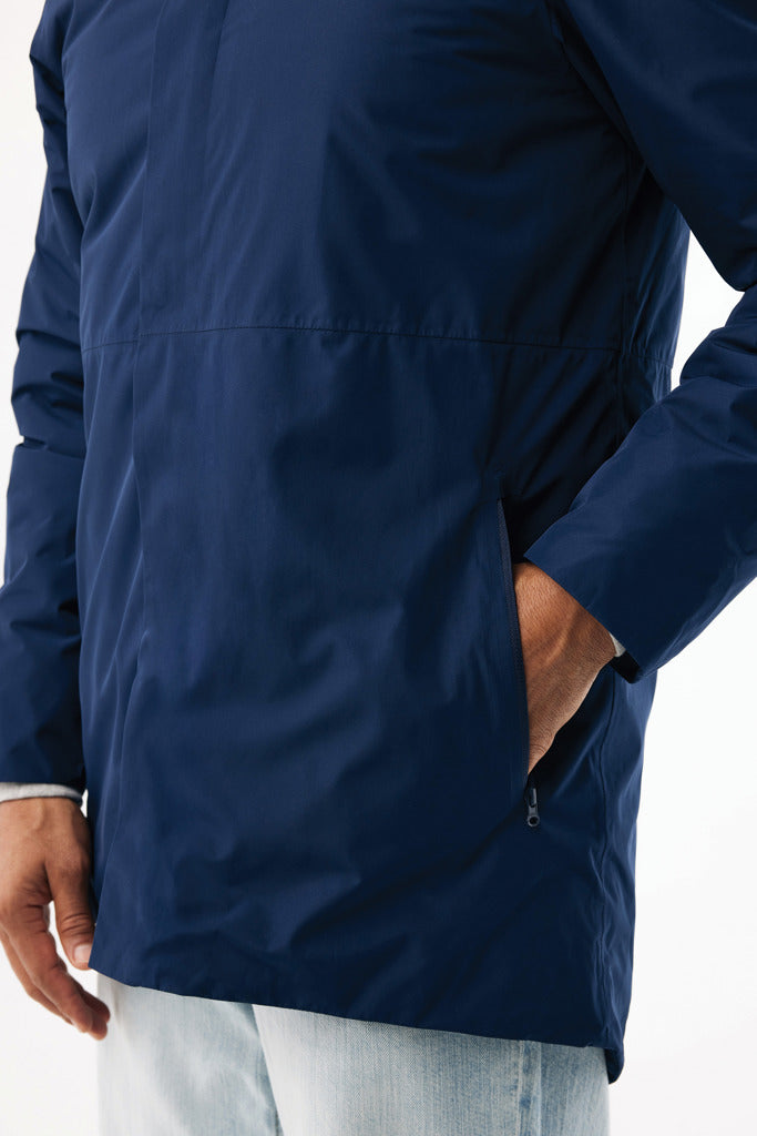Load image into Gallery viewer, Thelon recycled polyester parka by iqoniq, showing a close-up of the textile fabric with detailed stitching and texture.