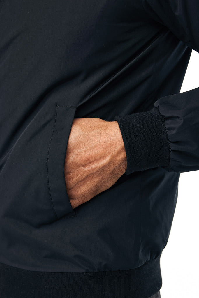 Load image into Gallery viewer, Iqoniq Odin recycled polyester urban jacket in textile, shown in a close-up view highlighting the fabric texture and design details.