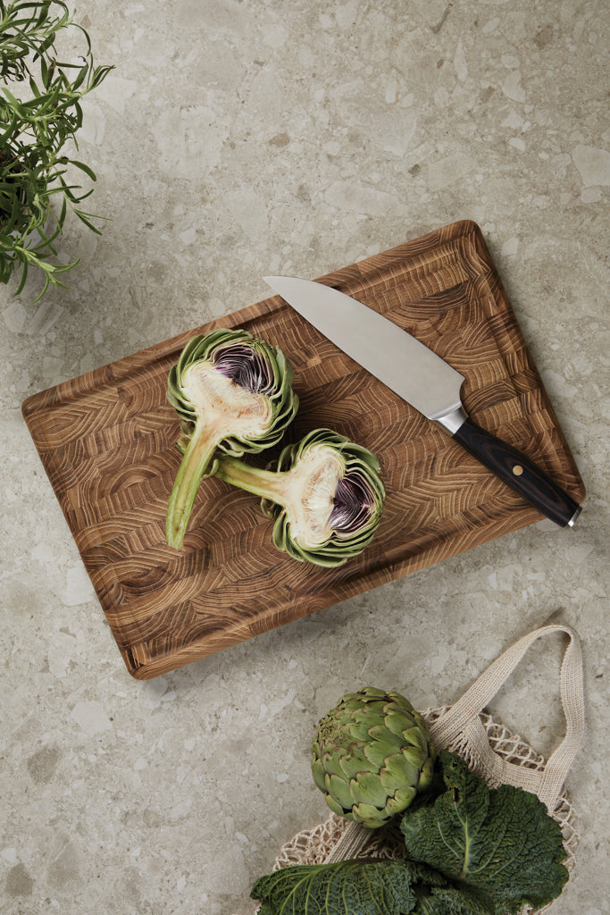 Load image into Gallery viewer, Vinga Tara steel chef's knife with black handle, sharp blade for cooking and food prep in a home kitchen setting.
