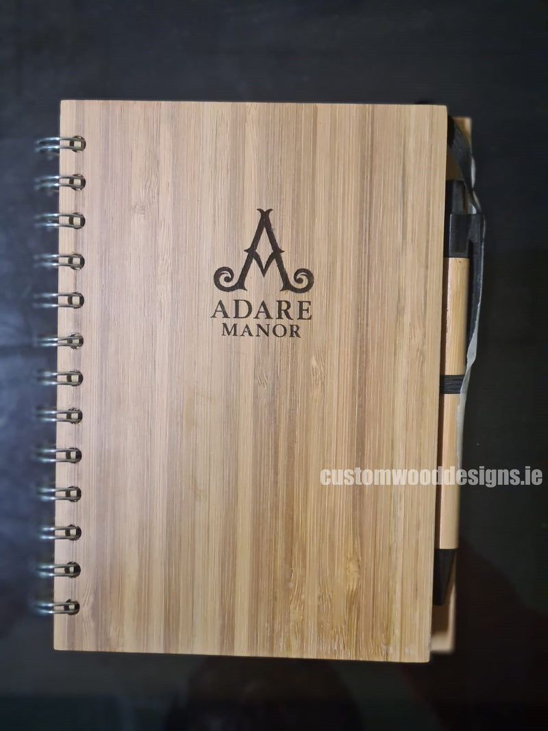 Load image into Gallery viewer, A5 Notebook pack of 25 Custom Wood Designs __label: Multibuy __label: Upload Logo WoodenBooksirelandcustomwooddesignsbrandedpromotionalproductsSustainablegiftideasBrandedworkproducts_12_59142299-ad7f-467b-931c-fead54d3536d