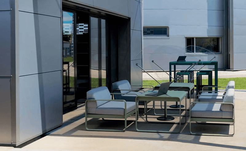 Load image into Gallery viewer, Fermob Bellevie armchair with woven rattan-style seat and backrest, metal frame in a modern outdoor furniture design