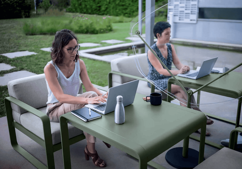 Load image into Gallery viewer, Fermob Bellevie armchair with a sleek metal frame and cushioned seat, modern outdoor furniture for stylish relaxation.