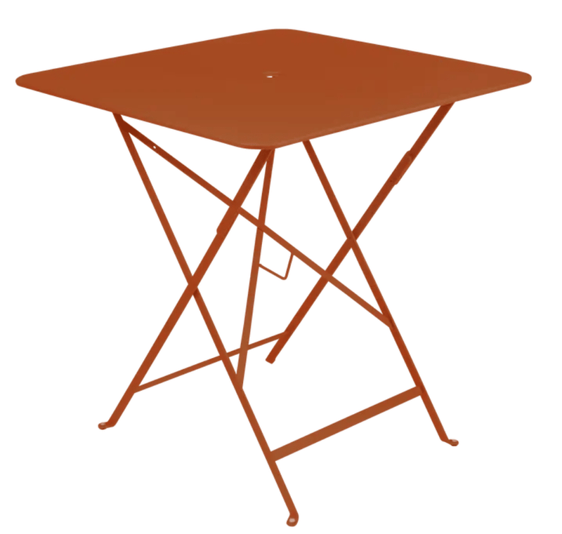 Load image into Gallery viewer, Bistro Table 71x71cm - Custom Wood DesignsFermob foldable outdoor bistro table, 71x71cm, with a powder-coated steel surface, ideal for cafes and outdoor dining setups.Foldable Table Ferob Outdoor7930.0Candied Orange
