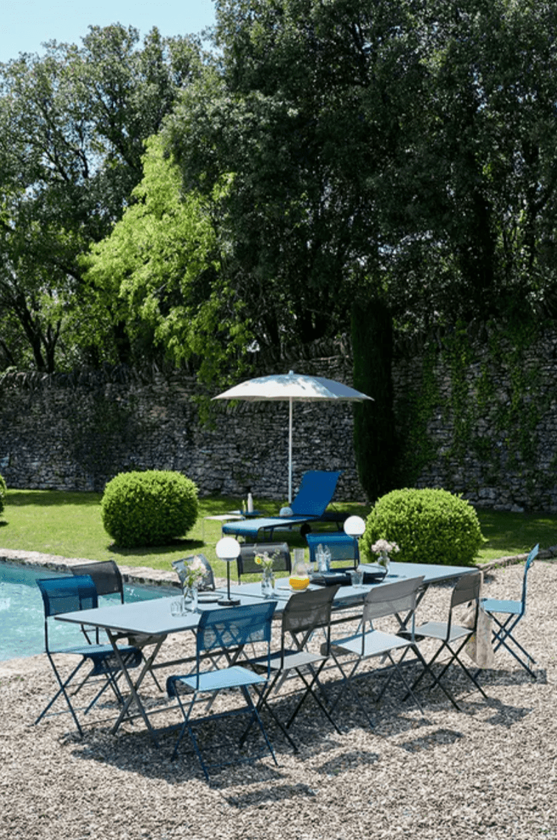 Load image into Gallery viewer, Fermob Caractère foldable outdoor table, 190 x 90 cm, eight-seater, with sturdy design and wood finish for outdoor dining.