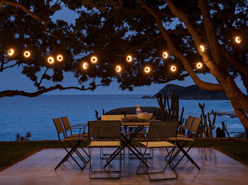 Load image into Gallery viewer, Fermob CARACTÈRE foldable outdoor table in beige, 128x128 cm, eight-seater with a sturdy design and smooth folding mechanism.