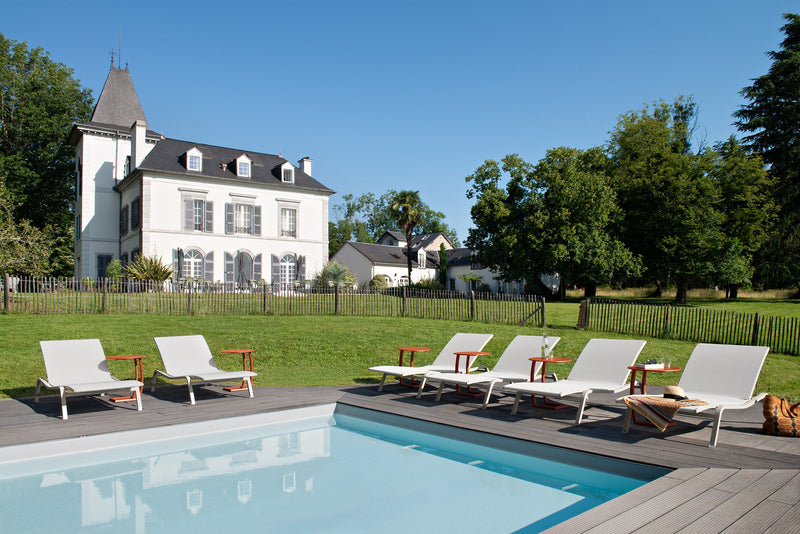 Load image into Gallery viewer, Fermob Alizé outdoor furniture in a garden setting