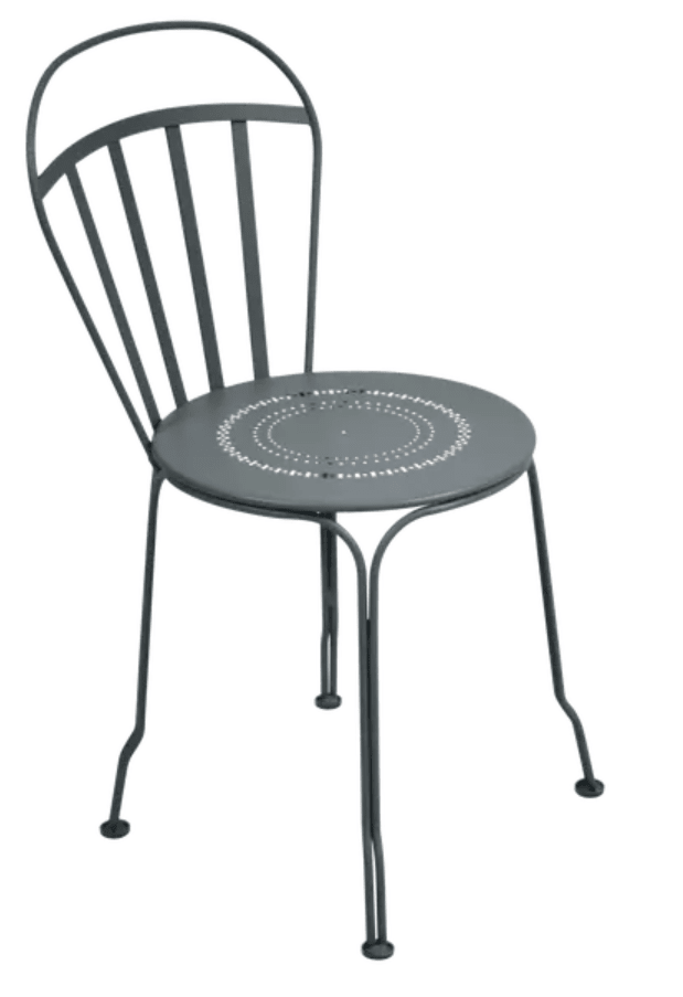 Load image into Gallery viewer, Storm grey Fermob Louvre outdoor chair with a sleek, modern design, featuring a curved seat and slender metal legs.
