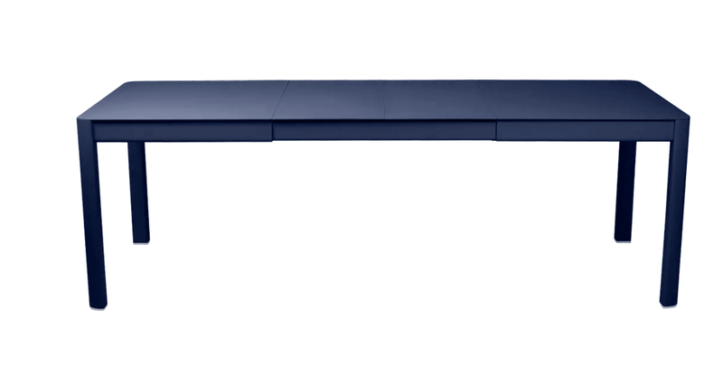 Load image into Gallery viewer, Deep blue Fermob Ribambelle extendable metal table set for 10, perfect for outdoor hospitality with aluminum design.
