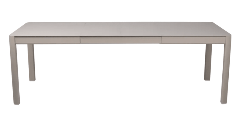 Load image into Gallery viewer, Fermob Ribambelle extendable metal table in nutmeg beige, outdoor 10-seater dining table with extendable aluminium design.
