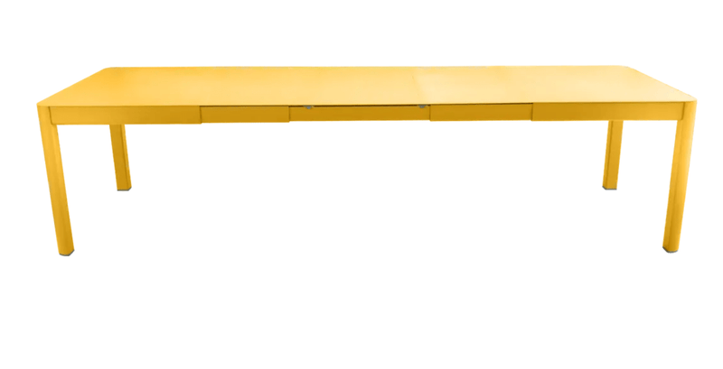 Load image into Gallery viewer, Large Fermob Ribambelle XL extendable metal table in honey orange, 14-seater, ideal for hospitality and gatherings.