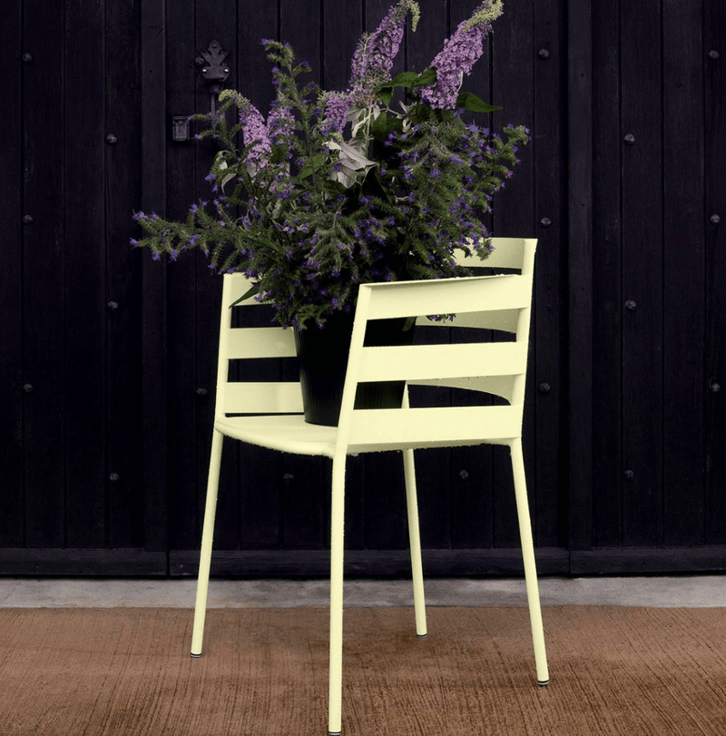 Load image into Gallery viewer, Fermob RYTHMIC outdoor armchair with colorful woven seat and metal frame, perfect for garden or patio seating.