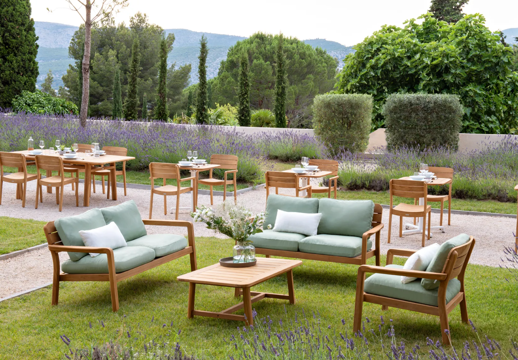 Fermob Lodge Low Armchair in teak, outdoor lounge chair with low armrests, ideal for outdoor hospitality and patio settings.
