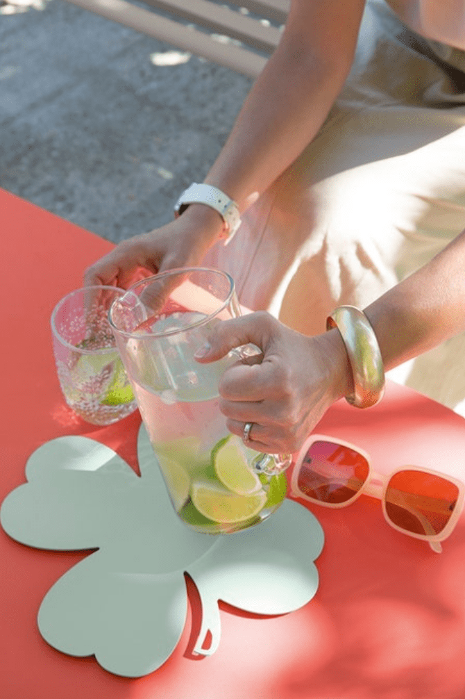 Load image into Gallery viewer, Fermob TRÈFLE non-slip metal trivet pad in ice mint color, 27x27 cm, with textured surface and non-slip backing.