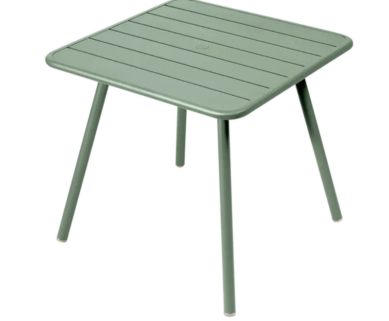 Load image into Gallery viewer, Willow green Fermob Luxembourg 4-leg metal garden table, 80x80 cm, outdoor furniture for patio or garden spaces.