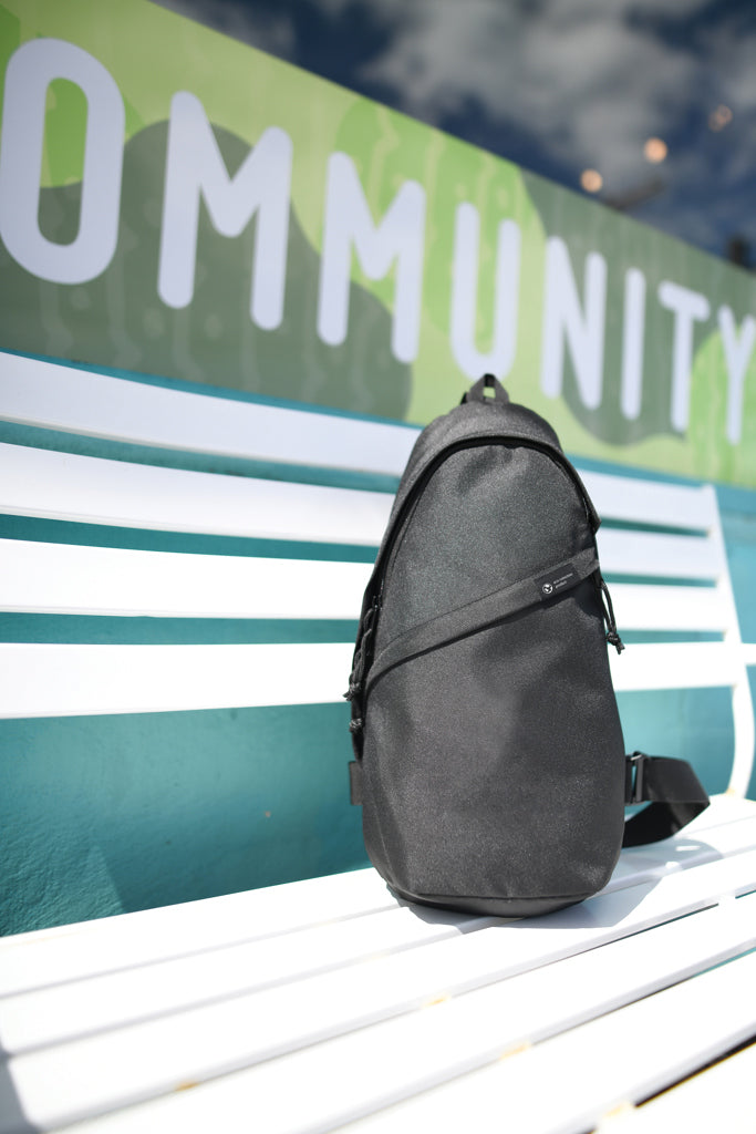 Load image into Gallery viewer, Renew AWARE™ rPET sling bag by XD Collection, eco-friendly bag with adjustable strap and spacious interior for travel and daily use.
