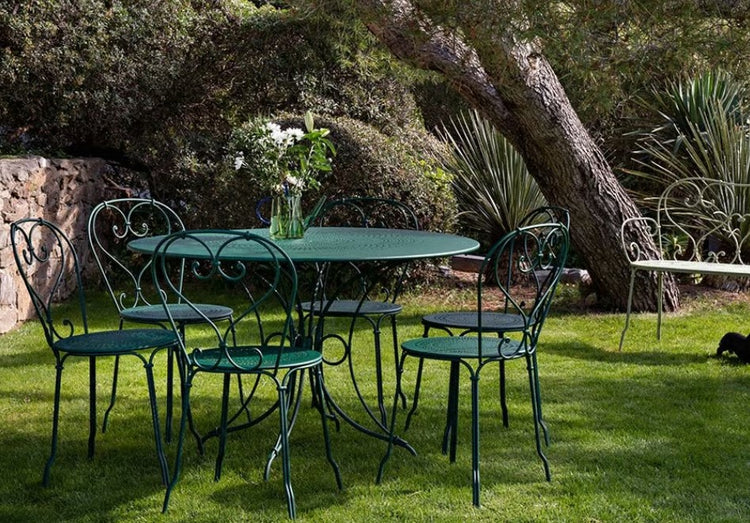 Fermob 1900 outdoor table with 96cm diameter, round metal table in a modern design, suitable for patio or outdoor dining spaces.