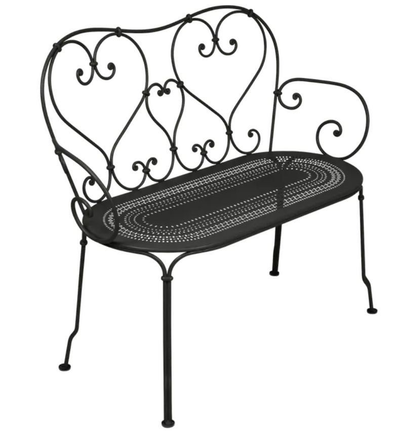 Load image into Gallery viewer, Fermob 1900 decorative bench with a curved design, featuring a glossy black finish and smooth wooden slats for outdoor seating.
