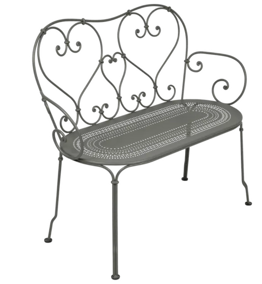 Decorative Fermob 1900 Bench in Rosemary color, featuring a stylish metal design suitable for indoor or outdoor seating.