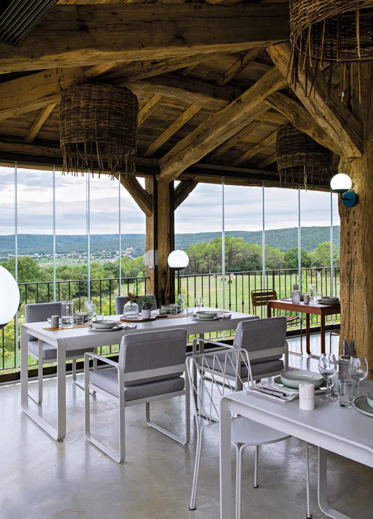 Fermob Bellevie outdoor dining table in wood and metal, 196x90 cm with storage, eight-seater design for outdoor patio.