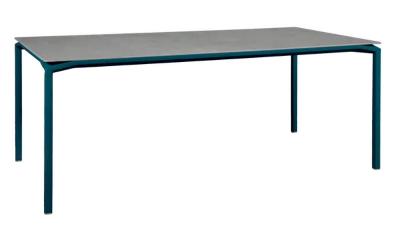 Load image into Gallery viewer, Fermob CALVI Kreta mineral dining table with eight seats, featuring a sturdy tabletop and modern design in natural stone finish.
