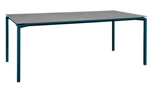 Fermob CALVI Kreta mineral dining table with eight seats, featuring a sturdy tabletop and modern design in natural stone finish.