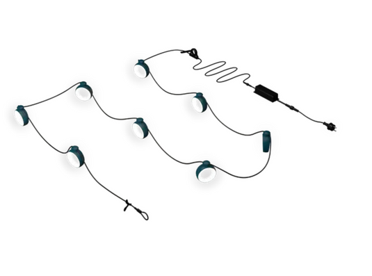 Fermob HOOPIK string lights, 1200cm outdoor lighting with warm bulbs hanging in an outdoor restaurant setting.