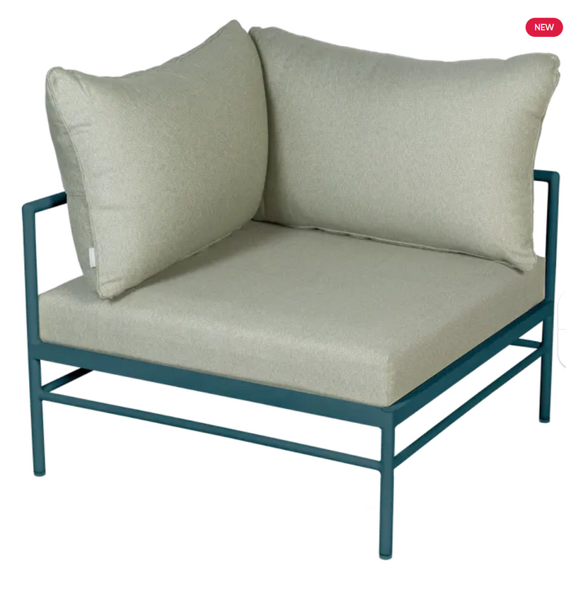 Load image into Gallery viewer, Fermob Rivage corner outdoor armchair in Meadow Green metal, featuring a stylish curved design for garden or patio seating.
