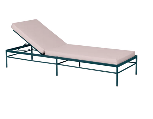Fermob Rivage luxury metal sunlounger with papyrus-colored fabric, outdoor patio furniture for relaxing in the sun.