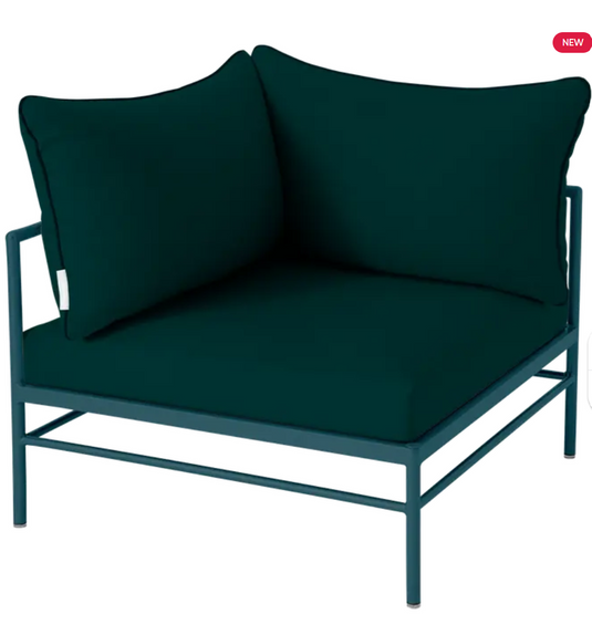Green Rivage corner armchair from Fermob's outdoor metal corner sofa collection, with a modern design and plush cushions.