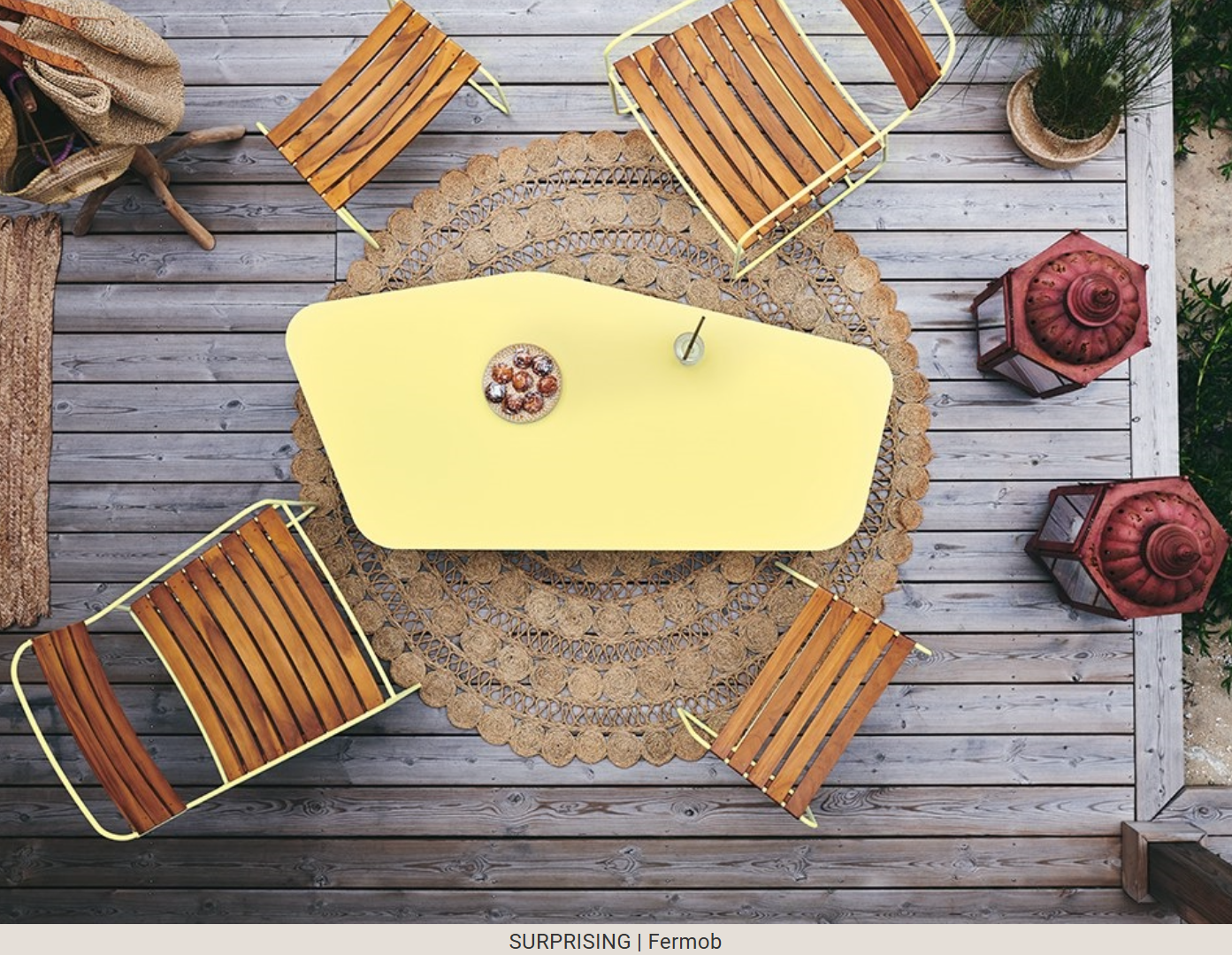 Fermob Surprising Teak Low Armchair made of metal, outdoor Acapulco-style chair with a modern design and comfortable seating.