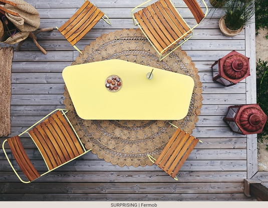 Fermob Surprising Teak Low Armchair made of metal, outdoor Acapulco-style chair with a modern design and comfortable seating.
