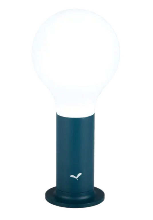 Fermob APLÔ Lamp H.24 with magnetic base, outdoor lighting fixture in vibrant yellow, designed for stylish illumination.
