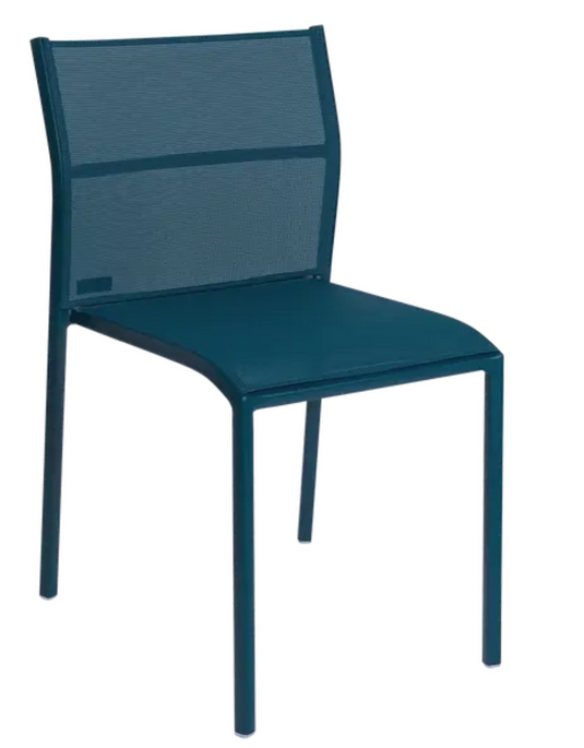 Fermob Cadiz outdoor chair with woven metal frame and colorful fabric seat, ideal for patio or garden seating.