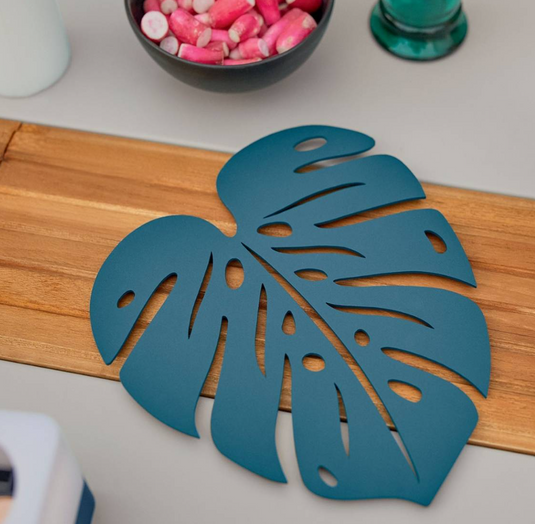Blue Monstera-themed Fermob non-slip metal pad with vibrant bouquet design, ideal for stabilizing and protecting surfaces.