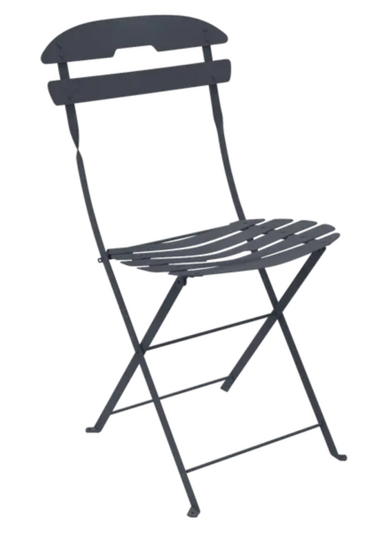 Fermob La Môme Chai folding chair in antracite color, lightweight and foldable, ideal for patio and outdoor seating.