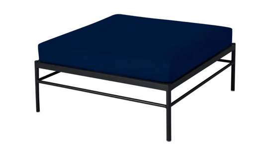 Fermob Rivage outdoor ottoman in midnight blue with an aluminum frame, suitable as a lounge footstool or side table.