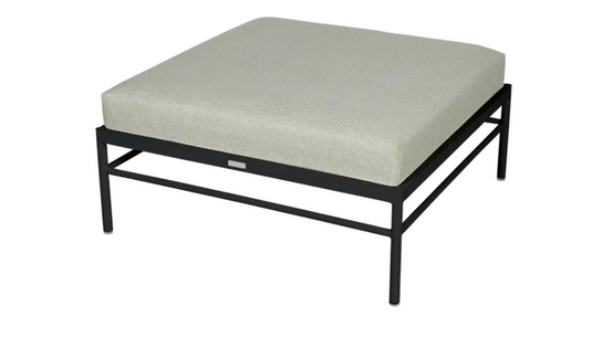 Fermob Rivage Ottoman outdoor furniture with an anthracite striated metal frame and plush cushion, ideal for outdoor lounge use.